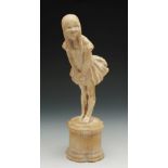 A Phoebe Stabler art deco plaster work type figure in the form of a little girl with ringlets,