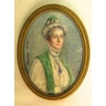 R Evans (early 20th century British school) - Half length miniature portrait of a lady in