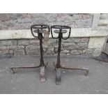 A pair of early wrought iron andirons with open rope twist basket finial's, 62 cm high approx