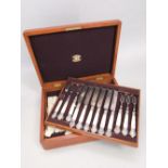 Golden oak three tier canteen of silver plated and mother of pearl flatware