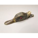 A Victorian cast brass ducks bill paper clip, the well modelled head with glass eyes