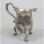 Good quality cast silver baluster faceted cream jug, upon 'S' scroll hoof feet, maker Harry Freeman,