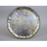 Early 20th century silver salver, with gadrooned rim and hoof feet, maker HE & Co Ltd, London