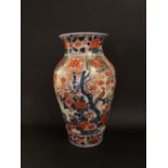 A large 19th century Imari vase of shouldered form with bird and flowering tree detail, 46 cm tall