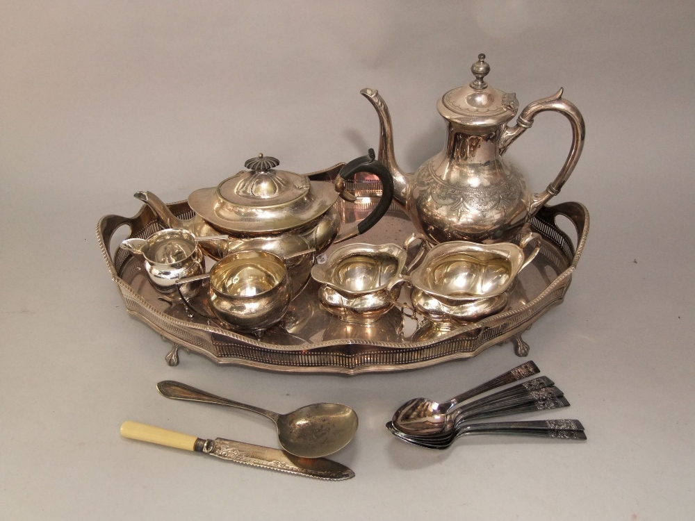 A mixed collection of silver plated items to include a twin handled serpentine gallery tray, various