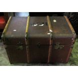 A vintage brown compressed fibre and timber lathe bound travelling trunk with brass fittings,