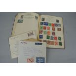 A Postboy Stamp Album containing a quantity of mid-20th century British and worldwide stamps