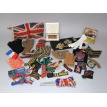 A collection of WWII and earlier military cloth badges, mittens, etc, Princess Mary Christmas box,