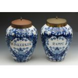 A pair of early 19th century Dutch Delft tin glazed earthenware blue and white painted tobacco