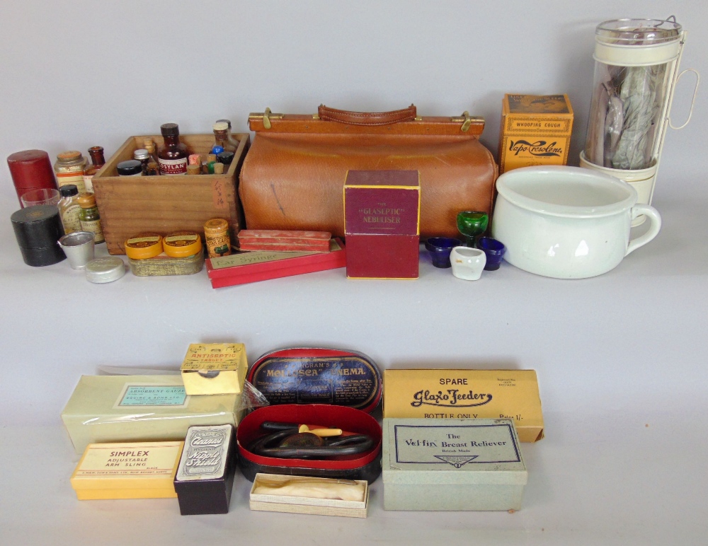 A mixed medical type lot to include a leather Gladstone bag, various medical boxed instruments to
