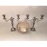 A pair of twin branch candelabra on square tapered columns, with art nouveau embossed styling's,