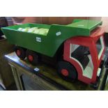 A hand built child's toy six wheeled lorry/dumper truck with brightly painted finish and