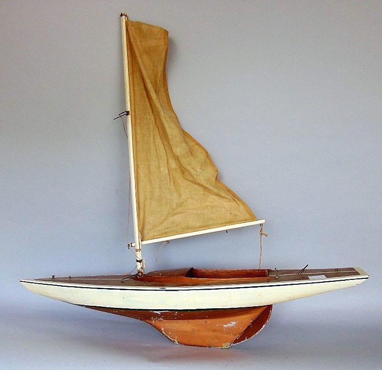 A good wooden pond yacht with textile sail