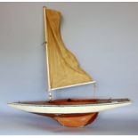 A good wooden pond yacht with textile sail