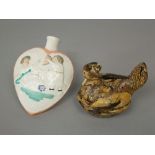 An unusual 19th century heart shaped flask with relief moulded decoration to each side of children