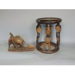 Tribal interest - African stool, the circular top on supports made up of carved standing gentlemen
