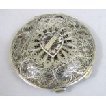 Persian/eastern white metal filigree work compact, the hinged lid enclosing a further enamel lid,