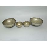 Four Nigerian white metal bowls, each inscribed Kano (4)