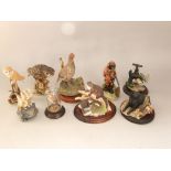 A collection of Border Fine Arts and other similar figure groups including Border Fine Arts otters