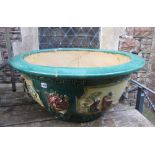 A large Chinese planter/jardiniere of squat circular and waisted form, partially green glazed with