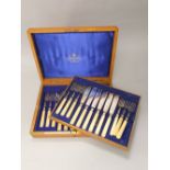 Goldsmiths & Silversmiths Co Ltd two tiered canteen of bone handled fish cutlery