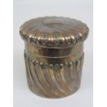 Late Victorian silver lidded pot with wrythen fluted embossed decoration, maker William Comyns,
