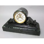 A 19th century black slate drum head mantle clock, with scrolled green veined marble decoration, the