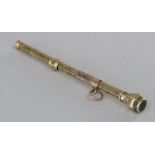 A Sampson Mordan & Co yellow metal propelling pencil fitted with monogrammed seal, 8.7cm approx