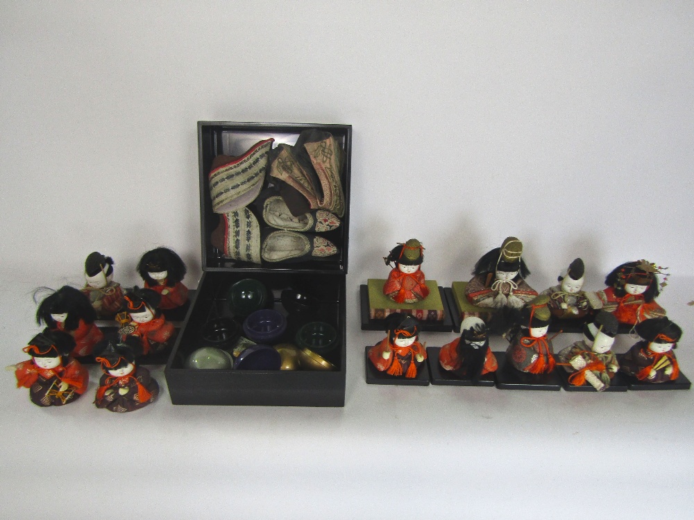 A mixed Japanese lot to include a collection of ceramic dolls making up a band, a lacquered box