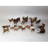 A collection of Beswick and other model horses including a trotting shire, a pony with raised