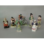 A collection of 19th century Staffordshire figures including a group of Hercules wrestling the lion,