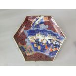 An unusual 19th century Imari charger of hexagonal form with painted and gilded decoration of five