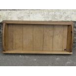 A sturdy oak tray of rectangular form with tongue and groove boarded base and canted ends together