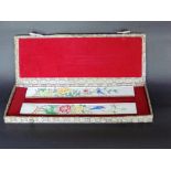 Cased pair of Canton enamel scroll weights, the box 30cm long