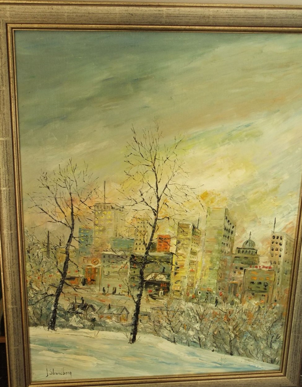 J Strandburg (20th century) - Winter city landscape, oil on canvas, signed, 60 x 45cm framed,