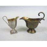 Two silver helmet cream jugs, one unmarked, 6oz approx