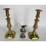 A pair of brass baluster candlesticks, together with a further silver plated pedestal jug (3)