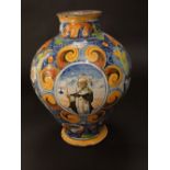An 18th century Italian tin glazed earthenware Arbarello drugs jar with polychrome painted