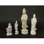 Two white glazed oriental figures of Guanyin, max height 25cm, together with a further similar white