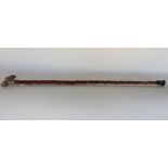 An interesting 19th century silver topped Sunday stick, with embossed white metal knop, with