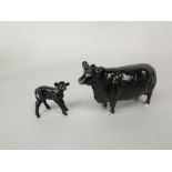 A Beswick model of an Aberdeen Angus cow, marked to base approved by the Aberdeen Angus Cattle