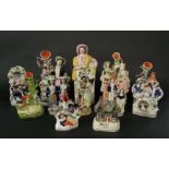 A collection of 19th century Staffordshire wares including a spill vase with sportsman, a watch