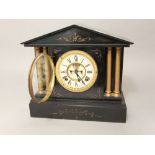 19th century black slate mantle clock with architectural case, the enamel chapter ring with Roman