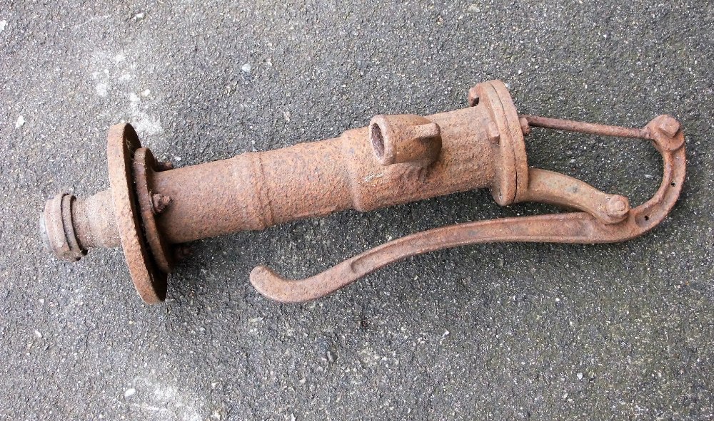 A late 19th/ early 20th century iron water pump (on view next to rostrum)