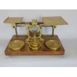 Impressive 19th century brass set of postal scales and weights, the scale platforms with various