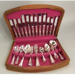 A teak cased canteen of silver plated kings handle cutlery