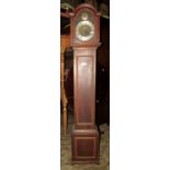 An oak cased grandmother clock with arched hood enclosing a brass dial with silvered chapter ring