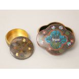 Qua-foil shaped cloisonné box and cover with iris detail and a further circular bronze box and cover