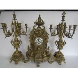 19th century French style ormolu type clock garniture, the dome shaped mantle clock mounted by a