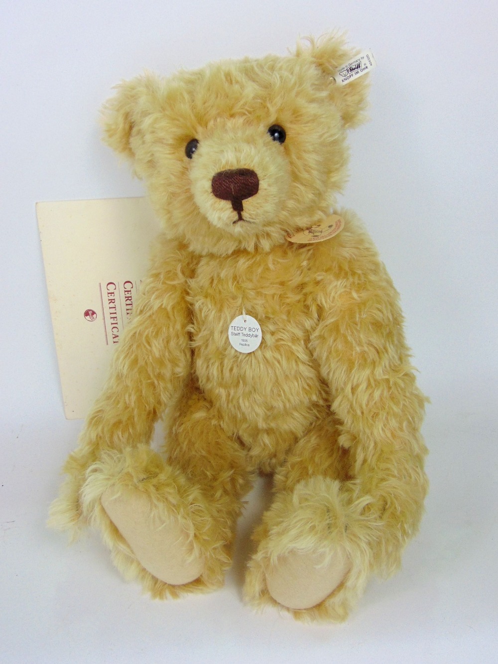 Steiff - "Teddy Boy" a 1905 replica, with original button in ear, tag and certificate, 50cm long